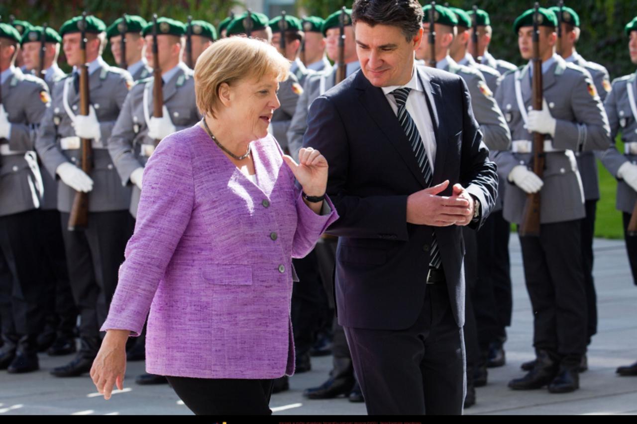 'German Chancellor Angela Merkel (CDU) receives Croatian Prime Minister Zoran Milanovic with military honors in front of the Federal Chancellery in Berlin, Germany, 19 September 2012. Merkel meets Mil
