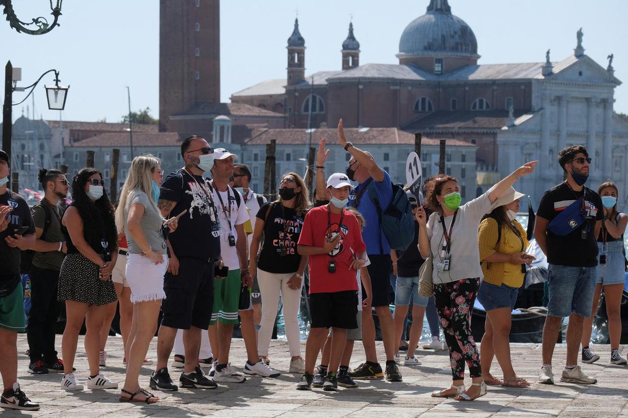 FILE PHOTO: Tourists visit Venice as the municipality prepares to charge them up to 10 Euro for entry into the lagoon city, in Venice