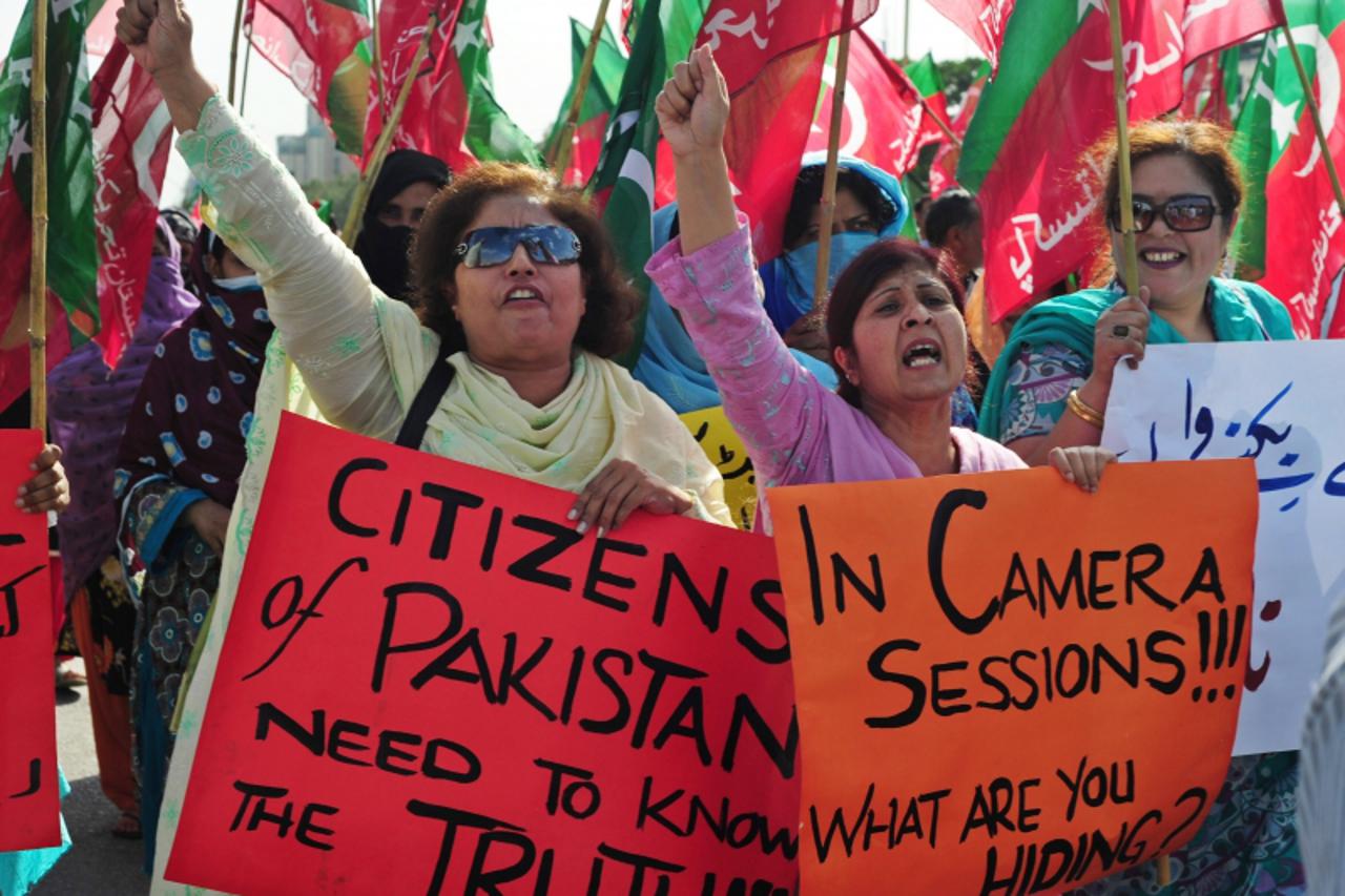 'Activists of Pakistan Tehreek Insaf  shout anti-government and military slogans over the Osama bin laden crisis during the joint sitting of parliament in Islamabad on May 13, 2011, where Pakistan\'s 