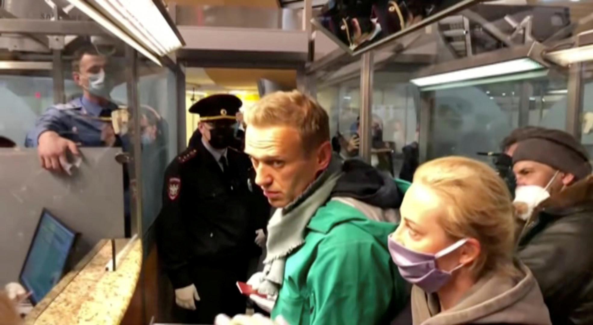 FILE PHOTO: Police officers detain Russian opposition leader Alexei Navalny in Moscow FILE PHOTO: A still image taken from video footage shows law enforcement officers speaking with Russian opposition leader Alexei Navalny before leading him away at Sheremetyevo airport in Moscow, Russia January 17, 2021. REUTERS/Reuters TV/File Photo REUTERS TV