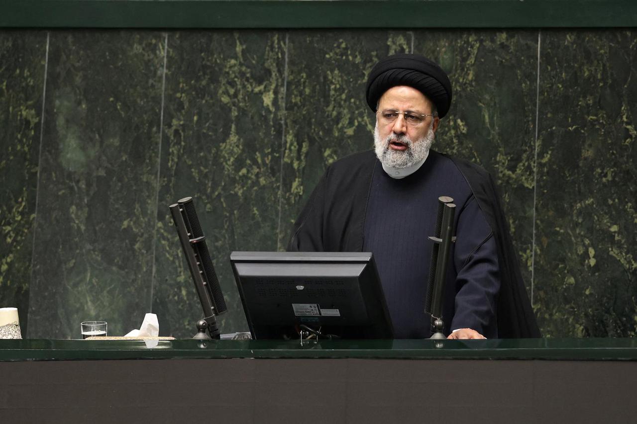 Iranian President Ebrahim Raisi speaks during a parliament meeting in Tehran