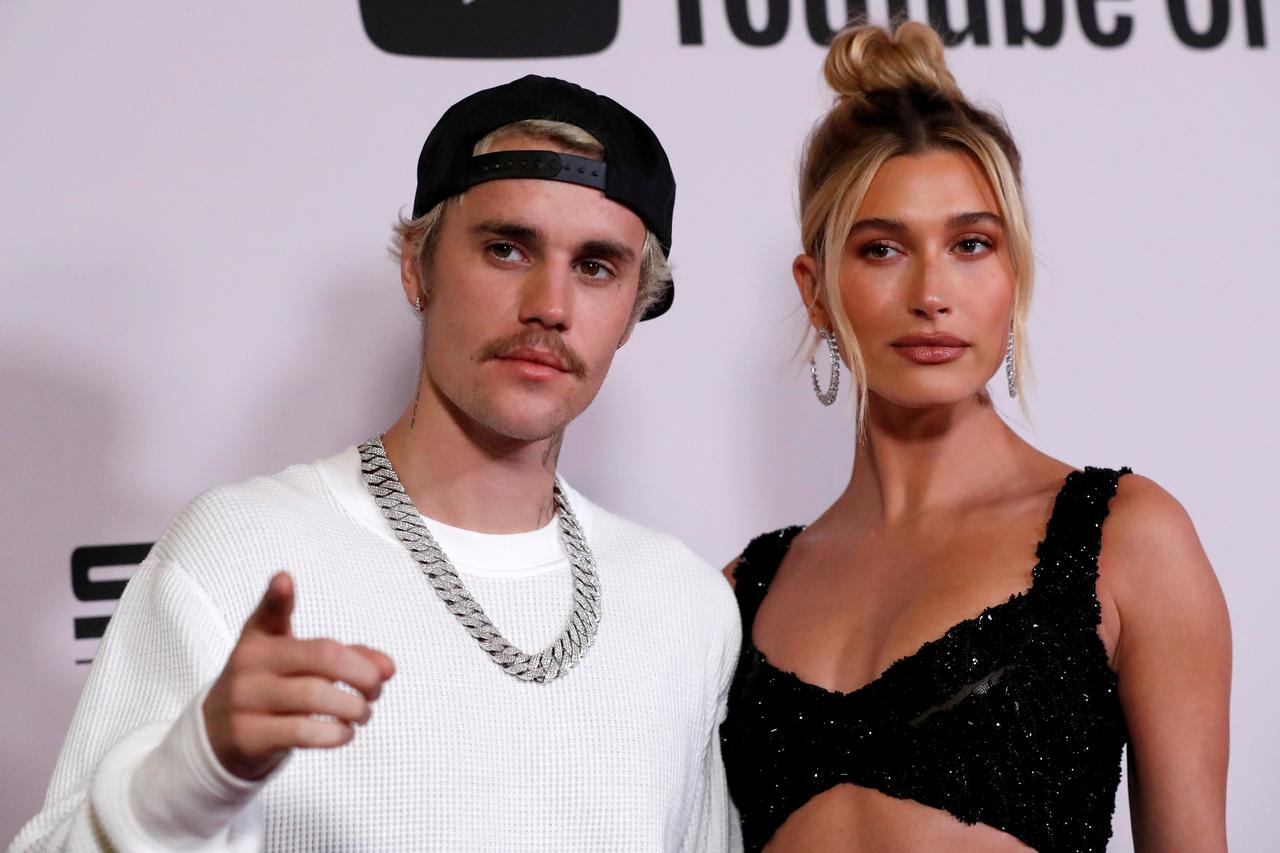 FILE PHOTO: Singer Bieber and his wife Hailey Baldwin pose at the premiere for the documentary television series "Justin Bieber: Seasons" in Los Angeles