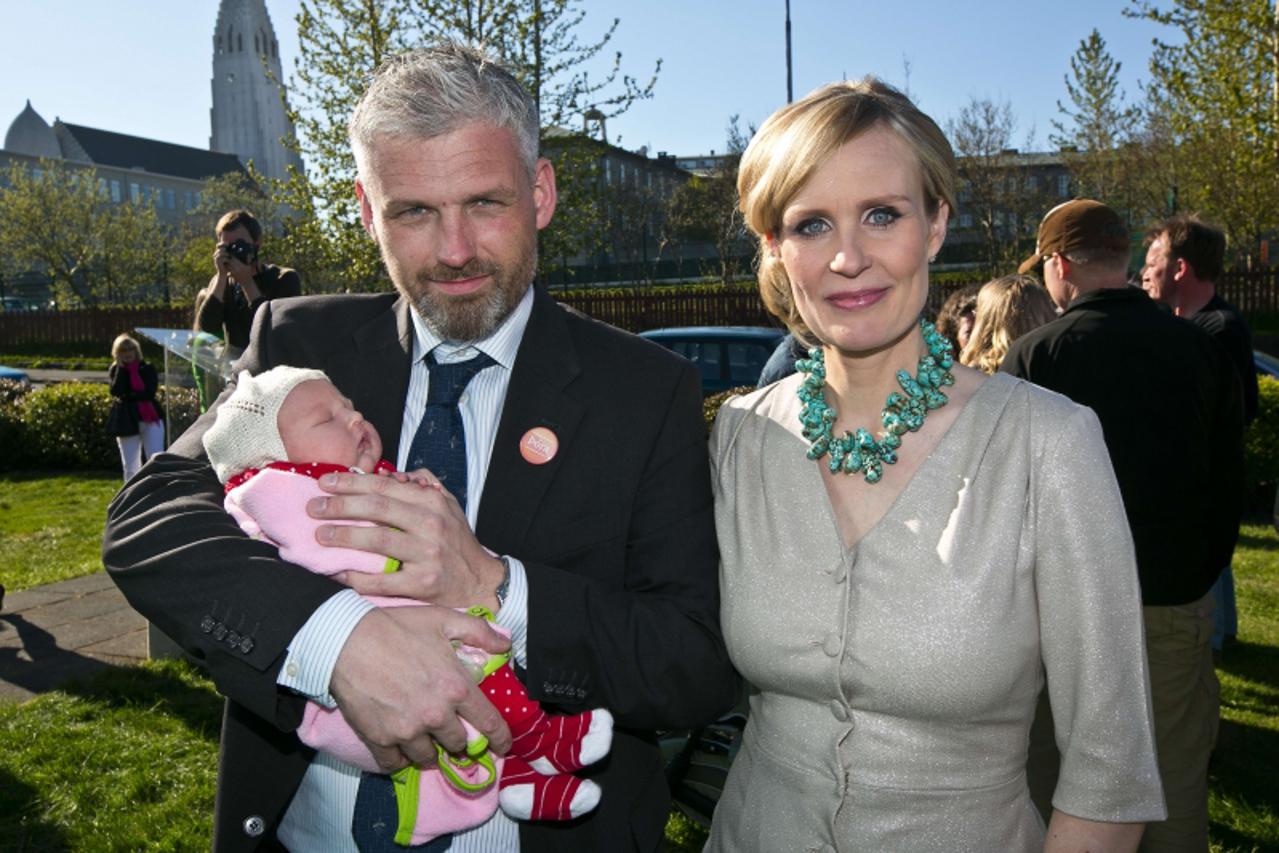 'In this photo taken on on May 28, 2012, Iceland journalist and presidential candidate Thora Arnorsdottir poses with her husband Svavar Halldorsson and their ten day old baby in Reykjavik. Iceland\'s 