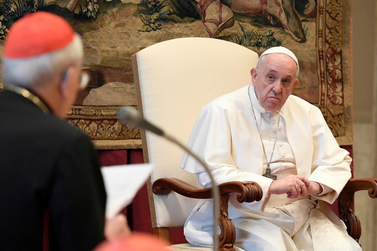 FILE PHOTO: Pope Francis listens during the traditional greetings to the Roman Curia at the Vatican