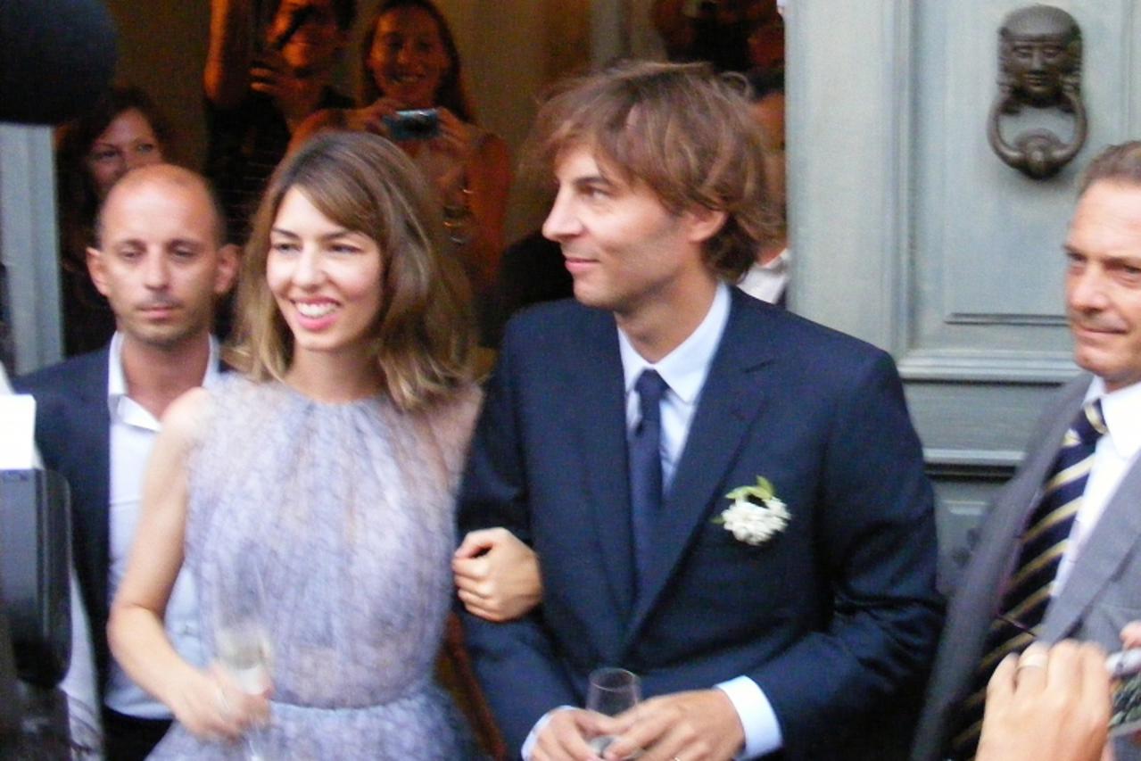 'Sofia Coppola and Thomas Mars leave after their wedding ceremony in Bernalda, on August 27, 2011.  AFP PHOTO/ ANDREA BALDO'