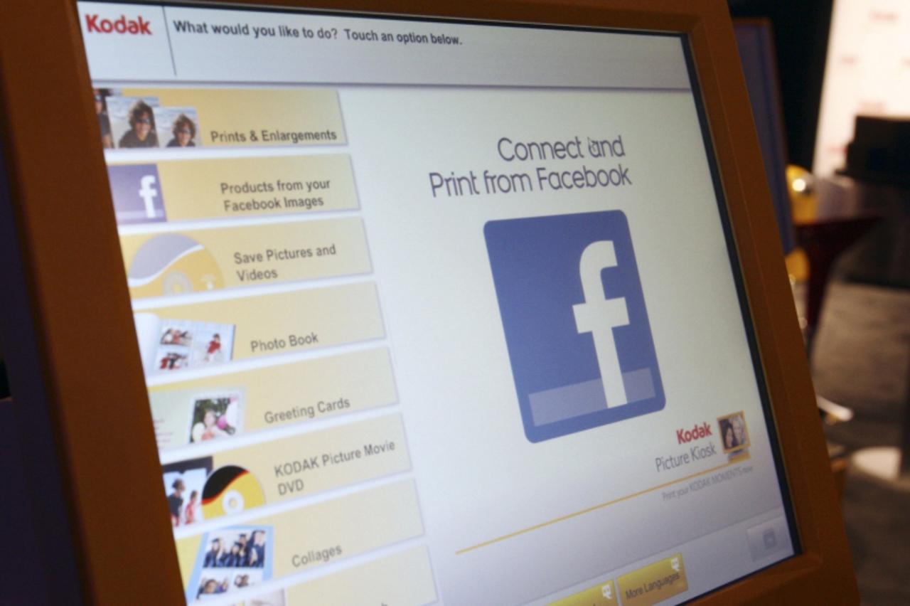 'A Facebook logo is displayed on a Kodak photo kiosk during the 2012 International Consumer Electronics Show (CES) in Las Vegas, Nevada, January 11, 2012. The Internet-enabled kiosk also lets you prin