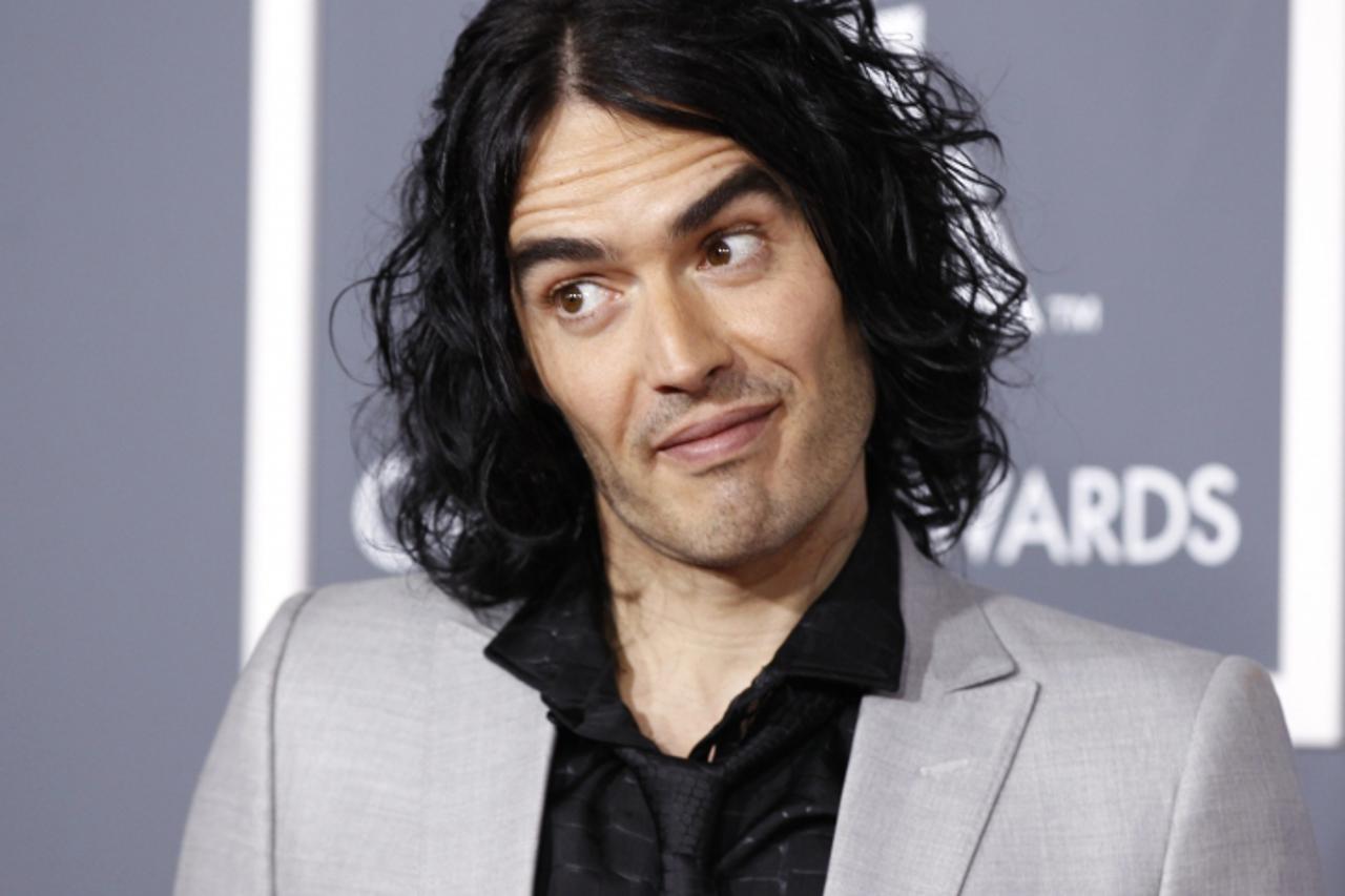 'British actor Russell Brand poses on arrival at the 53rd annual Grammy Awards in Los Angeles, California February 13, 2011. REUTERS/Danny Moloshok (UNITED STATES - Tags: ENTERTAINMENT HEADSHOT) (GRAM