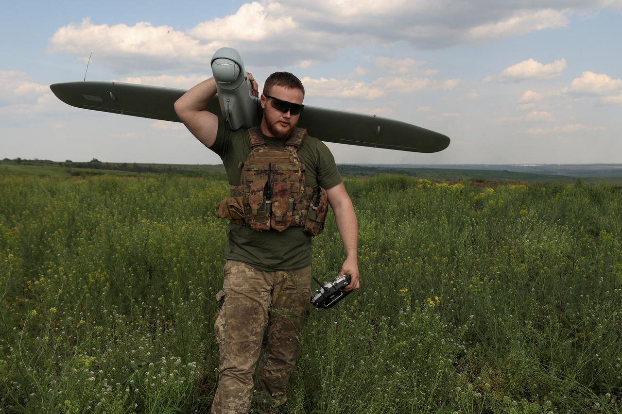Ukrainian serviceman set ups an antenna for controlling a reconnaissance unmanned aerial device near the city of Kostiantynivka