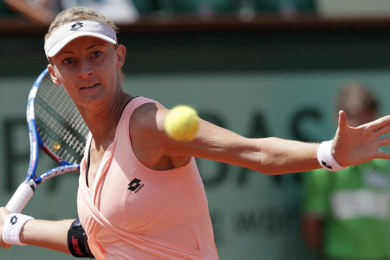 'Croatia\'s Mirjana Lucic returns the ball to Russia\'s Maria Sharapova during their Women\'s first round match in the French Open tennis championship at the Roland Garros stadium, on May 24, 2011, in