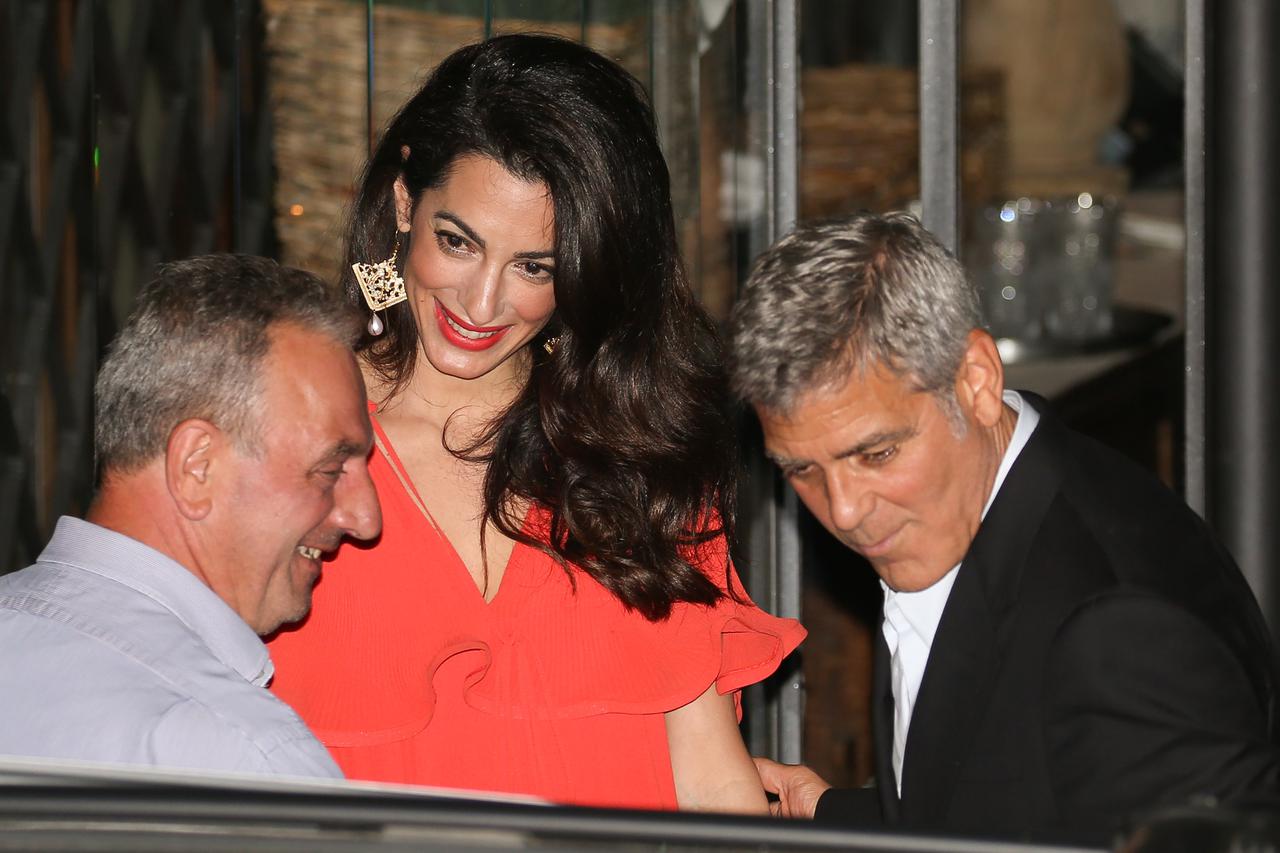 George Clooney and wife Amal Clooney, nee Amal Alamuddin, step out for dinner together at Gatto Nero's restaurant in Cernobbio, Italy.