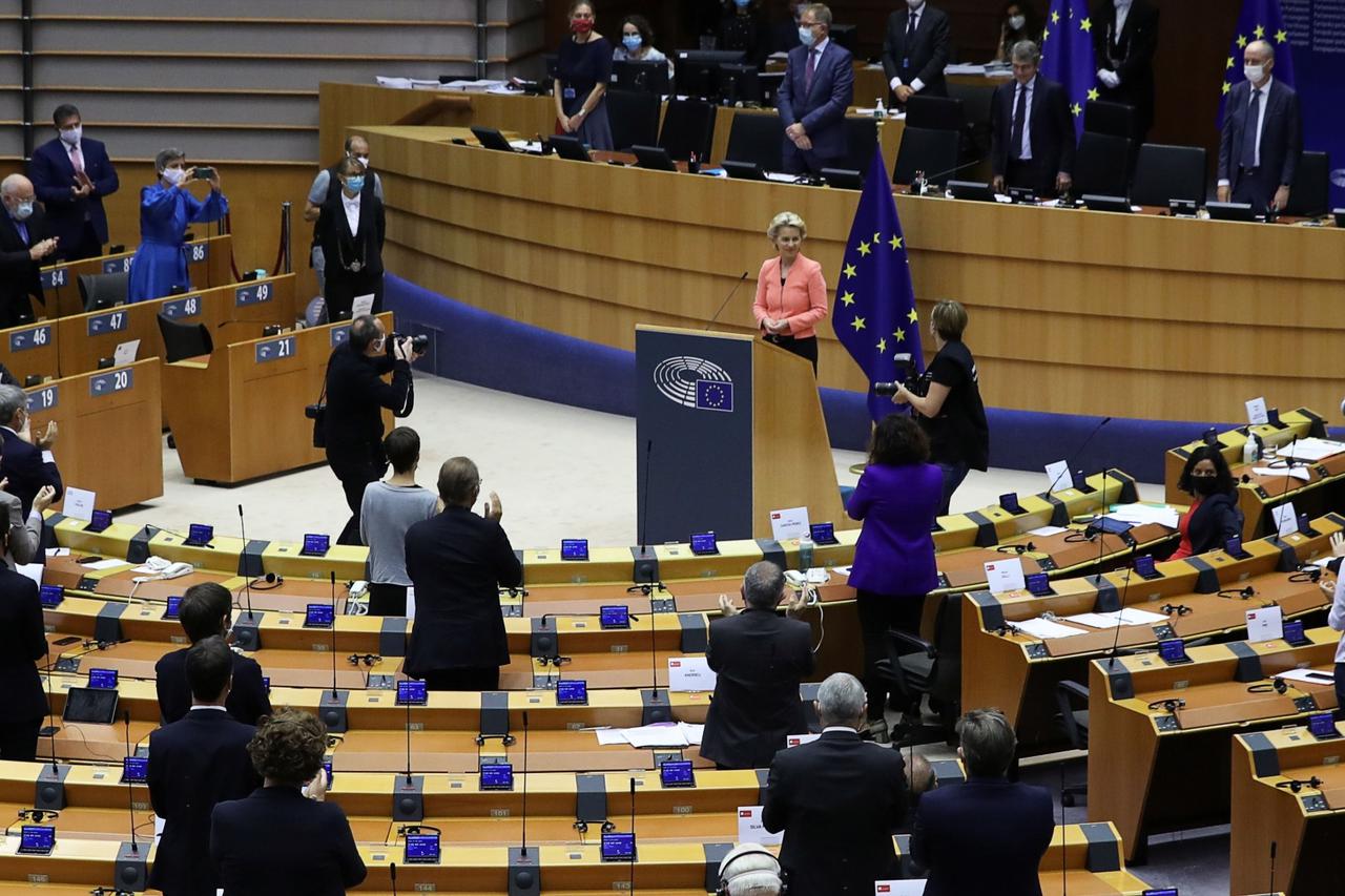 Members of the European Parliament applaud after European Commission President Ursula von der Leyen's first State of the European Union speech during a plenary session of the European Parliament, in Brussels