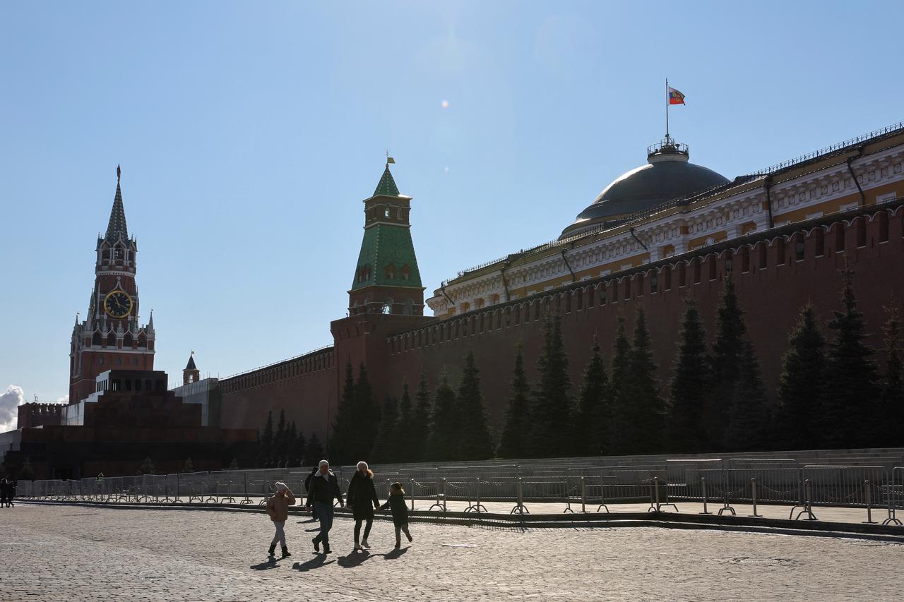 People walk in Red Square in Moscow