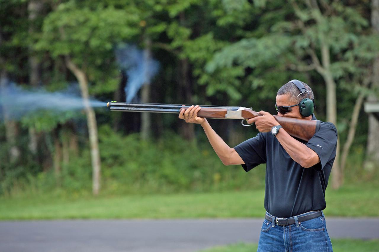 President Barack Obama shoots clay targets on the range at Camp David, Md., Saturday, Aug. 4, 2012. (Official White House Photo by Pete Souza)  This official White House photograph is being made available only for publication by news organizations and/or 