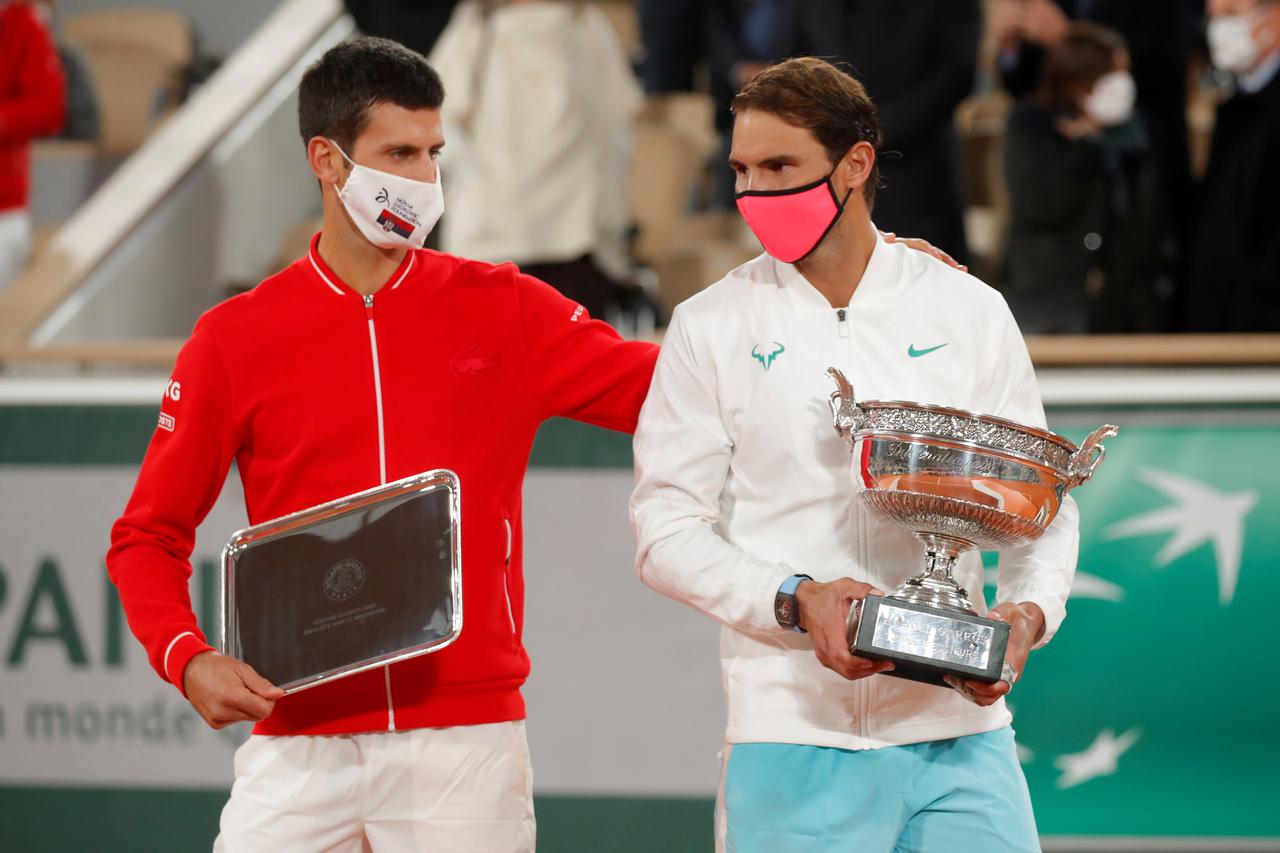 FILE PHOTO: French Open 2020 runner up Novak Djokovic of Serbia alongside French Open winner Rafael Nadal of Spain