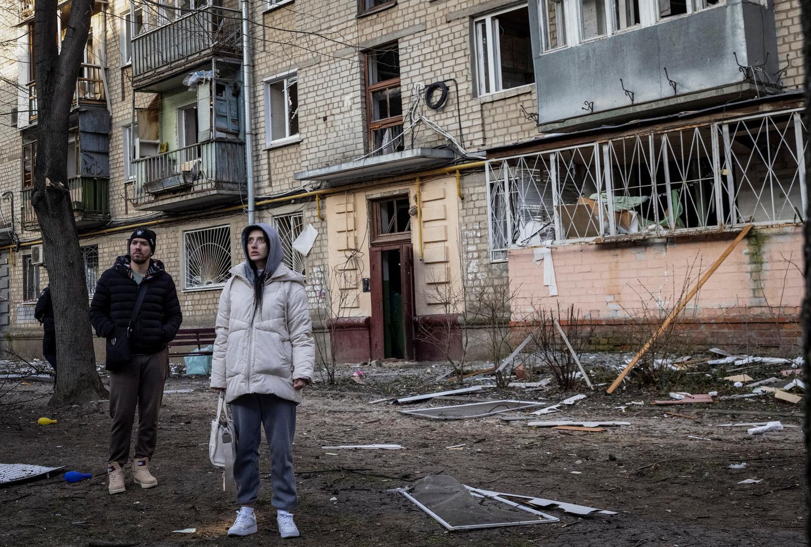 Local residents stand at the site where buildings were damaged by a Russian military strike, amid Russia's attack on Ukraine, in Kharkiv, Ukraine March 27, 2024. REUTERS/Yevhen Titov Photo: Yevhen Titov/REUTERS