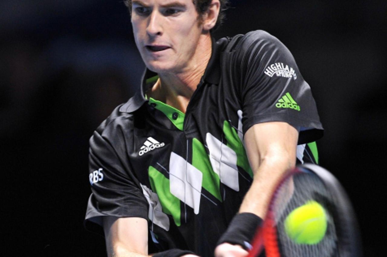 'Andy Murray of Great Britain plays against Robin Soderling of Sweden in a singles match during the Barclays ATP World Tour Tennis Final in London, on November 21, 2010. AFP PHOTO/GLYN KIRK'