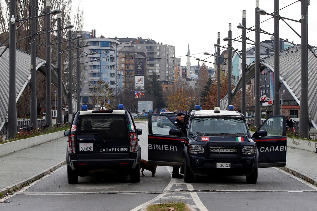 Italian carabinieri patrol the bridge which connects south and north Mitrovica in North Mitrovica