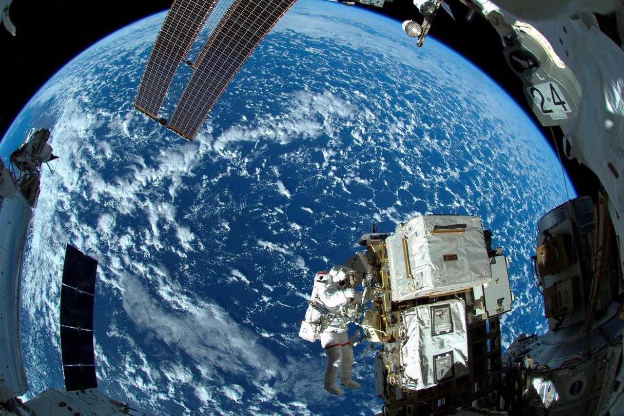 FILE PHOTO: NASA astronaut Reid Wiseman works outside the International Space Station