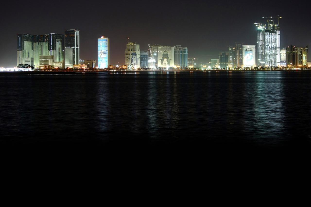 'A general view of central Doha at night is seen 07 November 2006 from the Qatari capital\'s corniche. Athletes from 46 countries will compete in 39 sports during the 1-15 December games in the Qatari