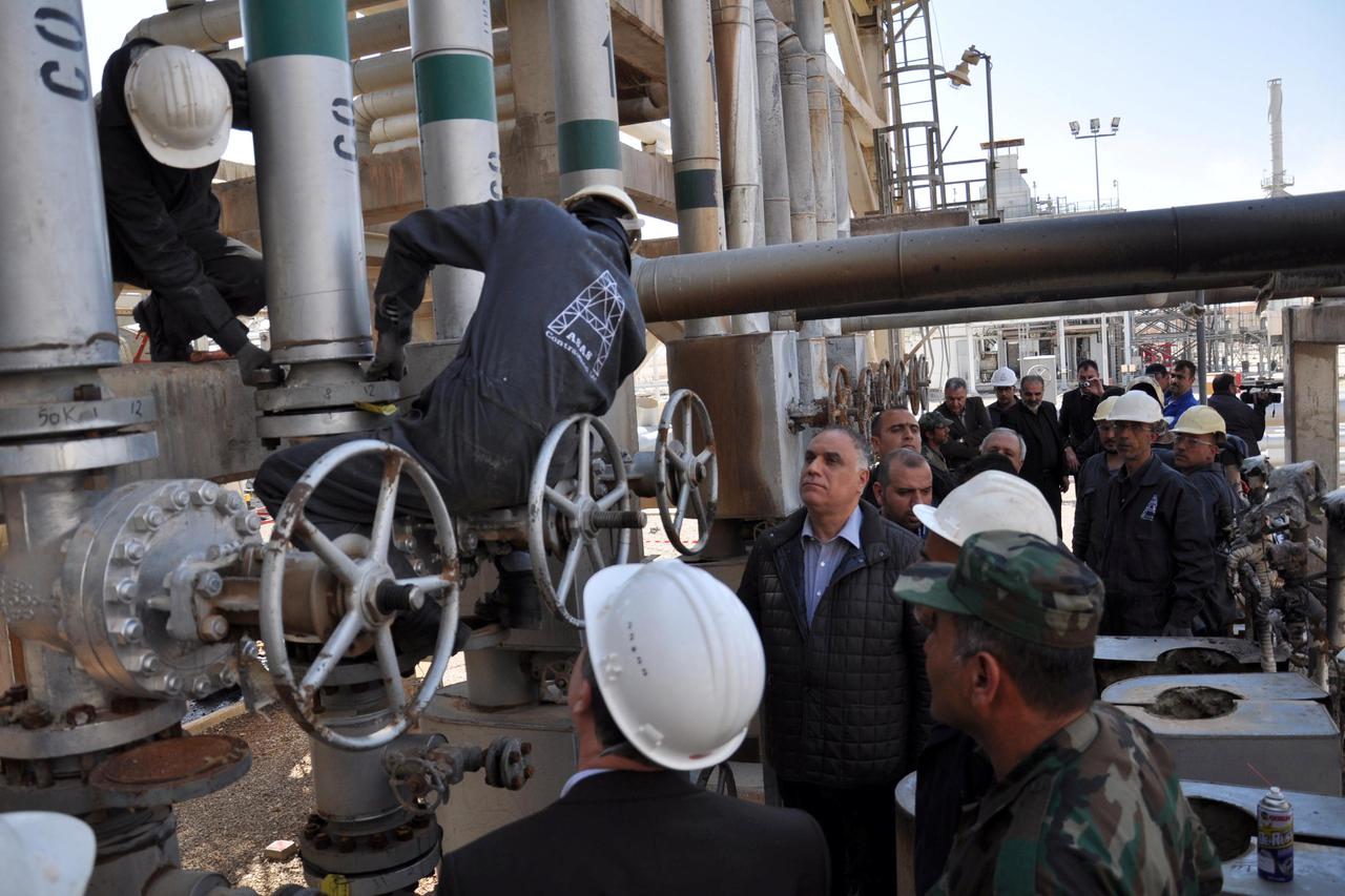 Workers are pictured at the Hayan gas factory and treatment plant during a visit by Syrian officials in Homs province Workers are pictured at the Hayan gas factory and treatment plant during a visit by Syrian officials in Homs province in this handout pic