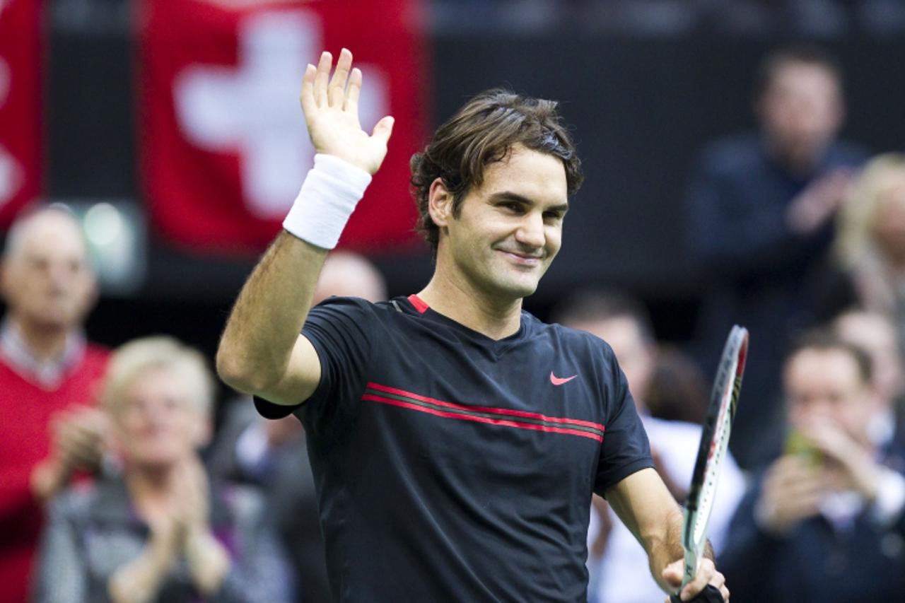 'Roger Federer of Switzerland celebrates winning his men\'s Semi-final match (4-6, 6-3, 6-4) against Nikolay Davydenko of Russia at the ABN AMRO tennis tournament in Ahoy, Rotterdam on  February 18, 2