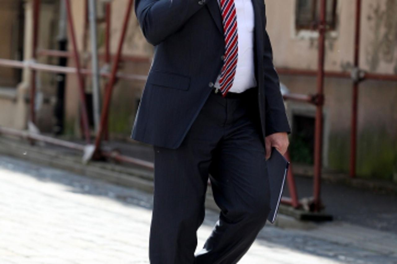 '07.06.2013., Zagreb - Ministar Mirando Mrsic telefonirajuci prosetao  preko Markovog trga. Photo: Patrik Macek/PIXSELL'