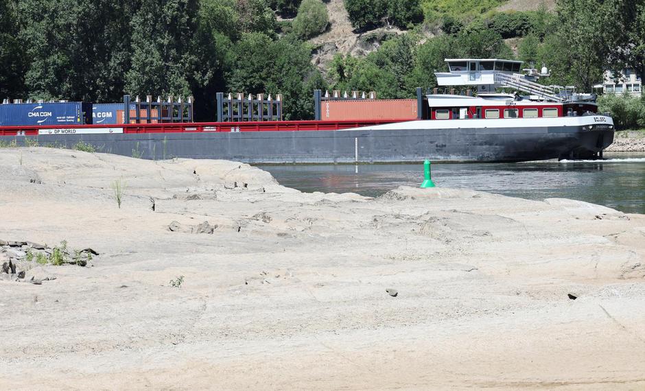 FILE PHOTO: Low water levels after recent dry weather continue to prevent cargo vessels from sailing fully loaded on the river Rhine in Germany