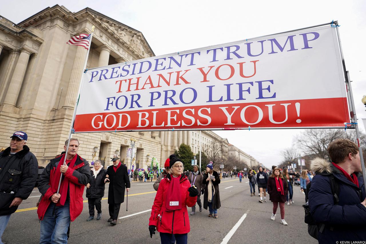 FILE PHOTO: Anti-abortion activists march with banner thanking President Trump during the 47th annual March for Life in Washington
