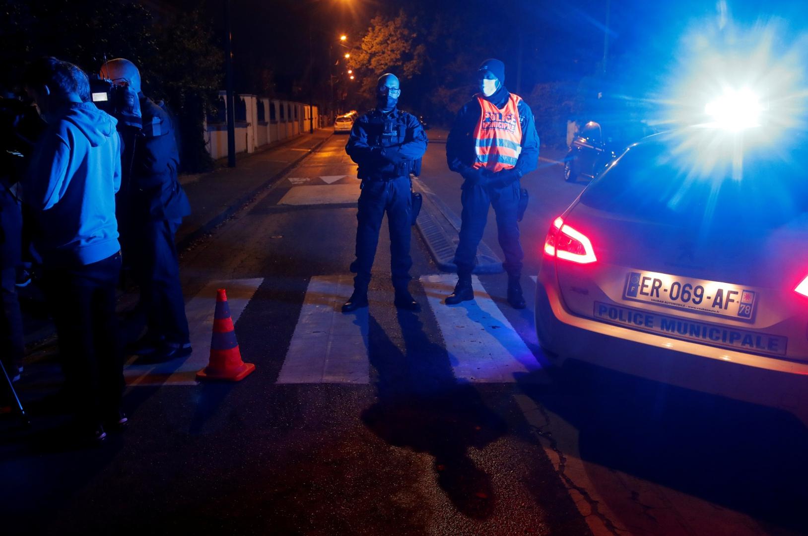 Stabbing attack in the Paris suburb of Conflans St Honorine Police officers secure the area near the scene of a stabbing attack in the Paris suburb of Conflans St Honorine, France, October 16, 2020. REUTERS/Charles Platiau CHARLES PLATIAU