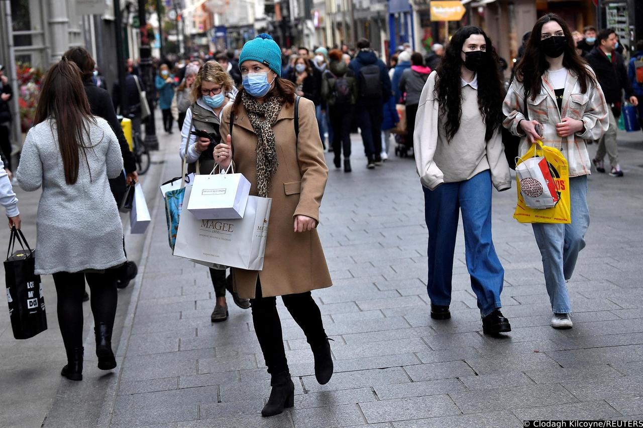 FILE PHOTO: People wear protective face masks while out for Christmas shopping in Dublin