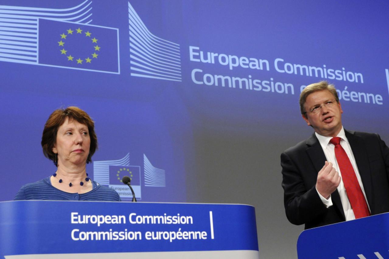 'European Union Commissioner for Enlargement Stefan Fule (R) gives a press conference with European Union Foreign Affairs and Security Chief Policy Catherine at the EU Council building in Brussels, on