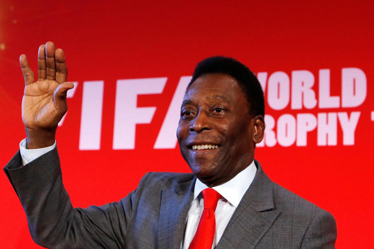 FILE PHOTO: Brazilian soccer great Pele attends a news conference in 2014 to present the FiFA World Cup global "Trophy Tour" in Paris