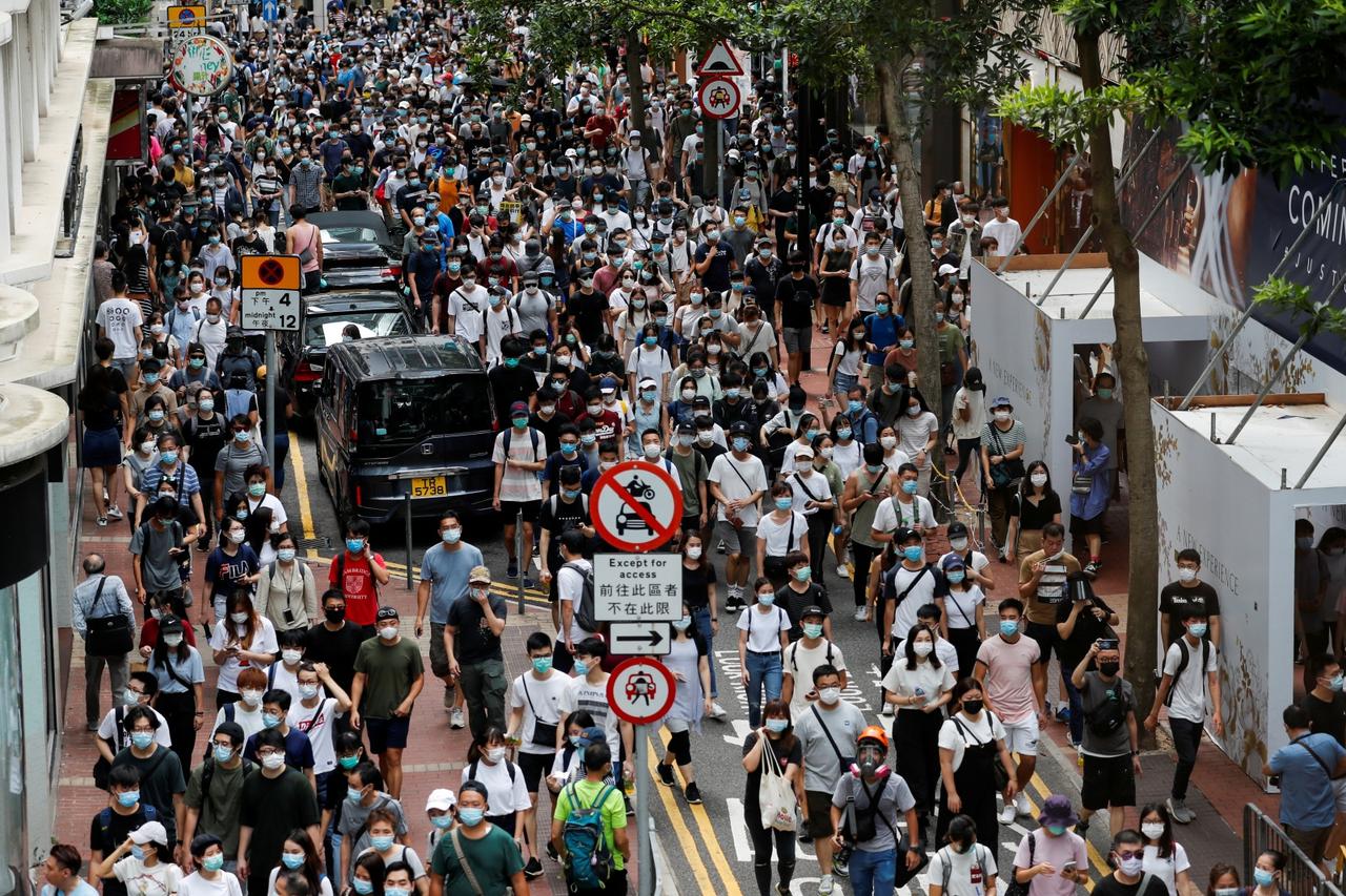 FILE PHOTO: Anti-national security law protesters march at the anniversary of Hong Kong's handover to China from Britain, in Hong Kong