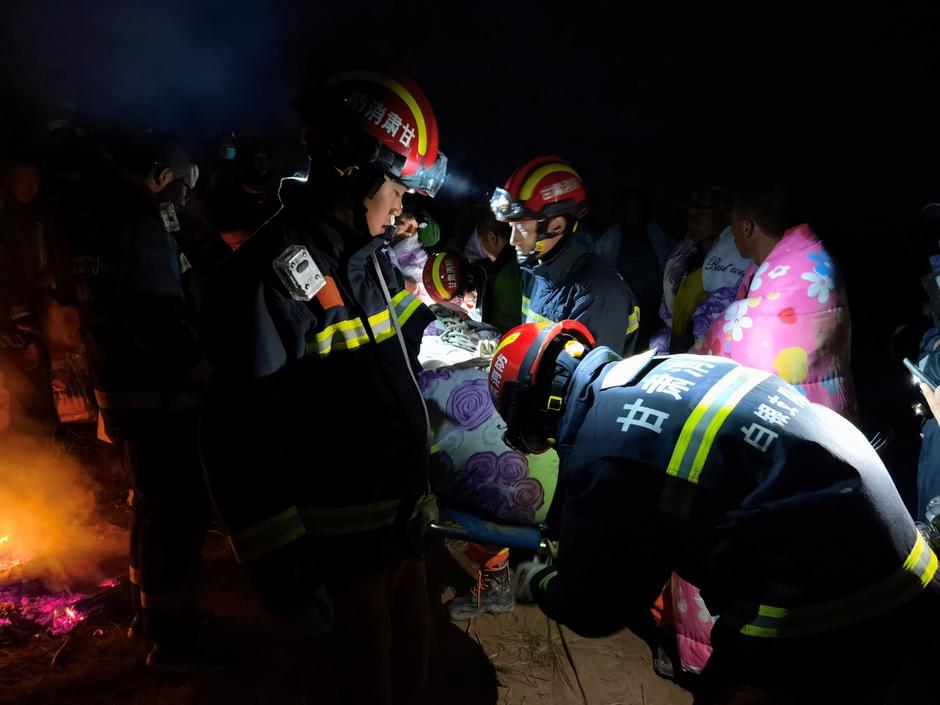 Rescue workers work at the site of the accident where extreme cold weather killed participants of an 100-km ultramarathon race in Baiyin