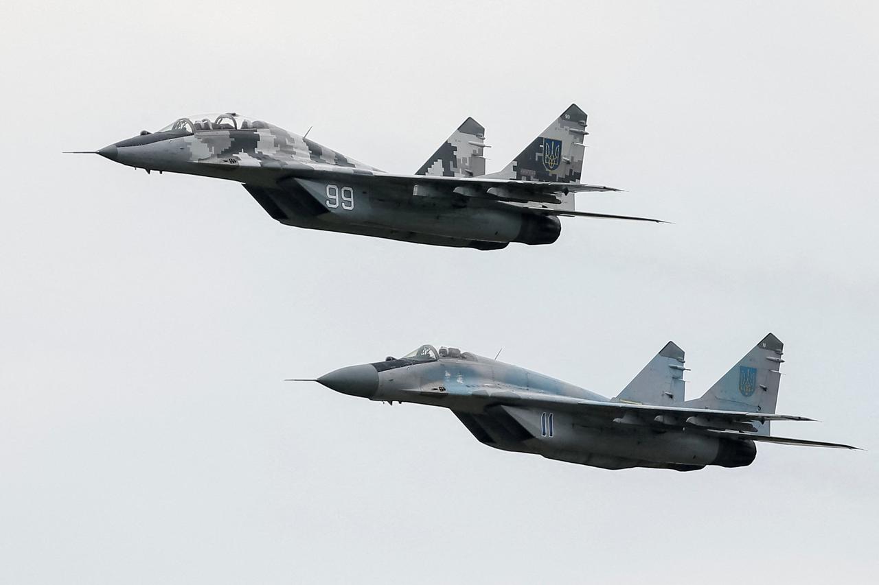 FILE PHOTO: MIG-29 fighter aircrafts fly at a military air base in Vasylkiv
