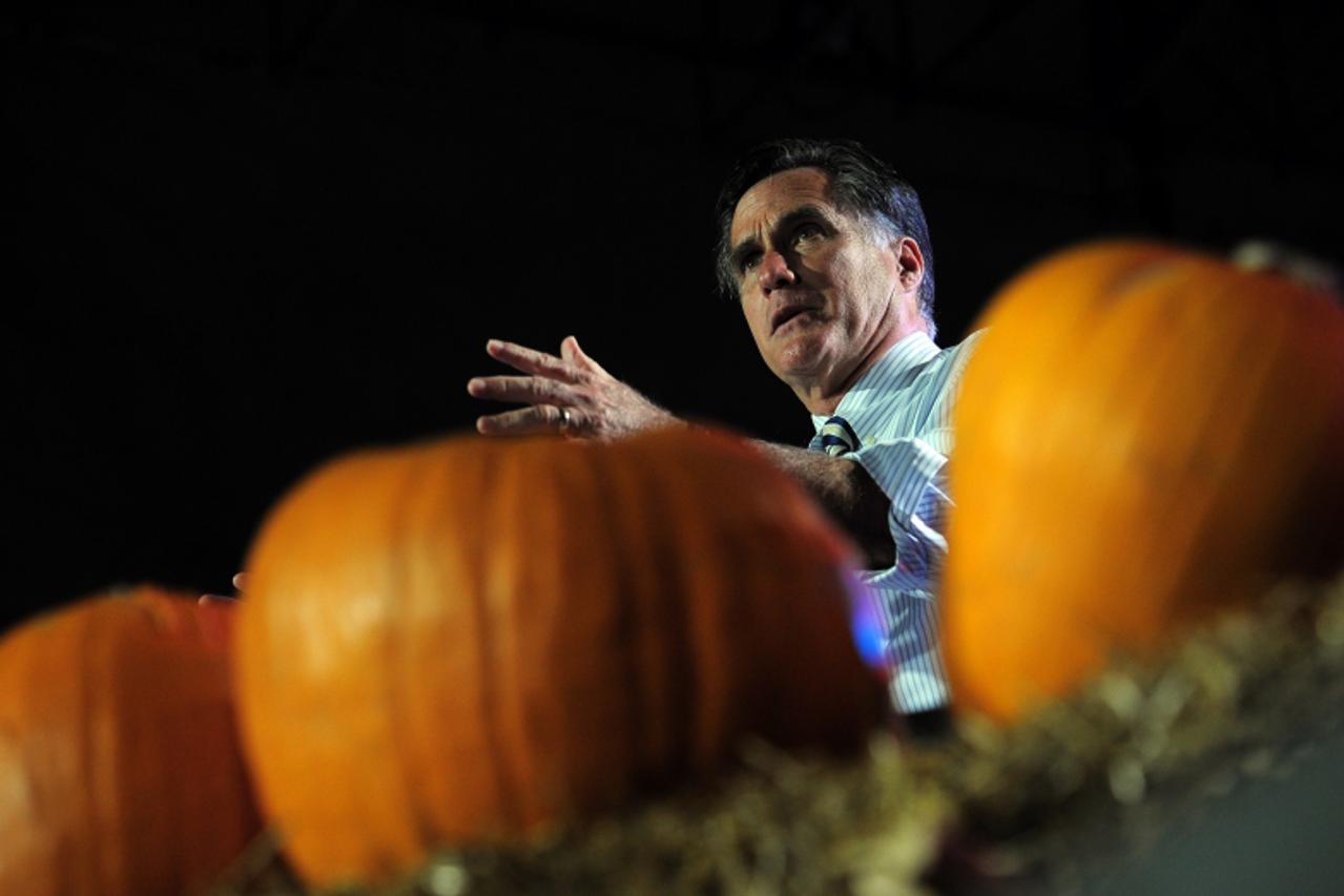 'US Republican Presidential candidate Mitt Romney holds a campaign rally on Halloween at Metropolitan Park in Jacksonville, Florida, October 31, 2012. AFP PHOTO/Emmanuel DUNAND '