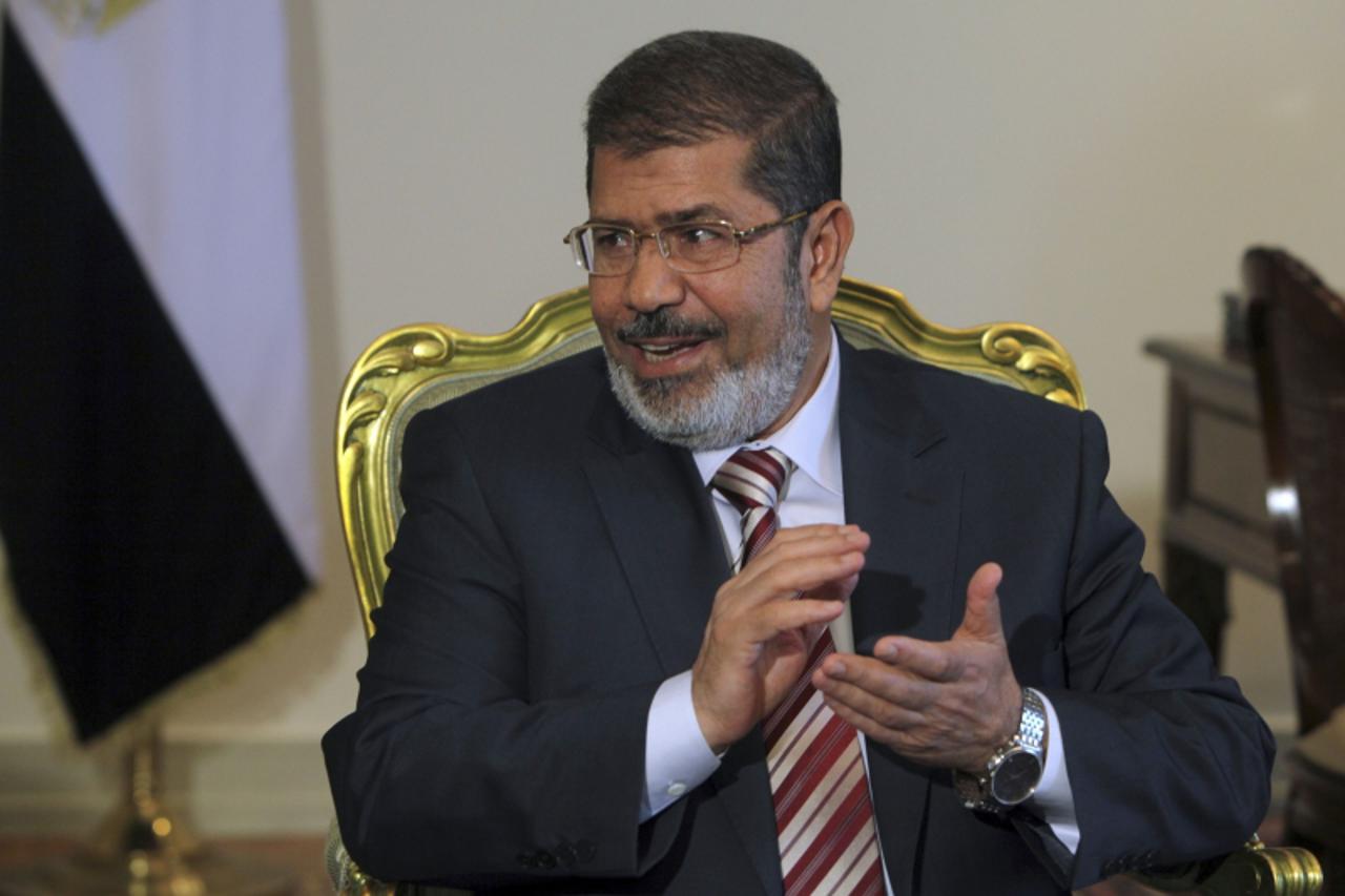 'Egypt's President Mohamed Mursi attends a meeting with Palestinian President Mahmoud Abbas at the presidential palace in Cairo July 18, 2012 .REUTERS/Amr Abdallah Dalsh  (EGYPT - Tags: POLITICS)'