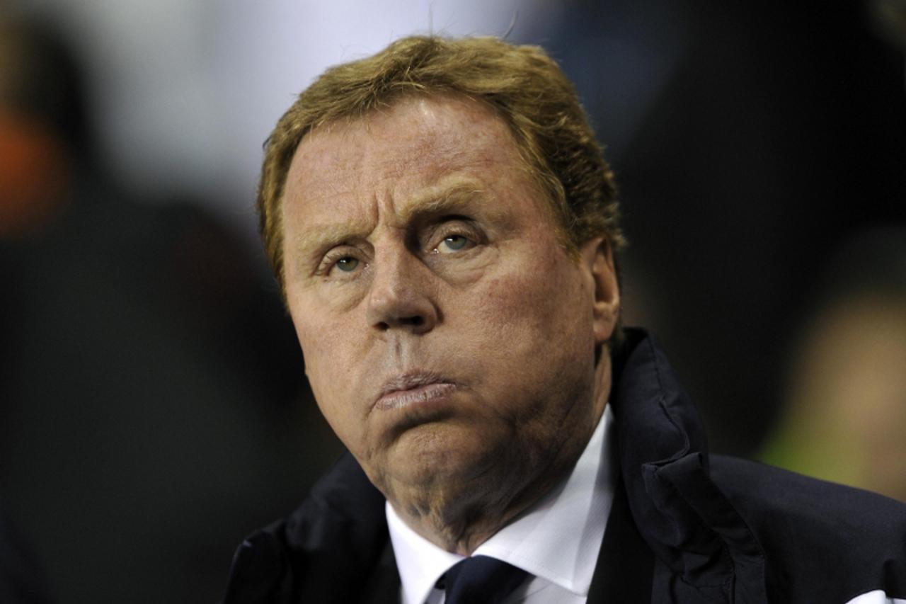 'Tottenham Hotspur\'s manager Harry Redknapp reacts before their Champions League soccer match against AC Milan at White Hart Lane in London March 9, 2011.    REUTERS/Dylan Martinez (BRITAIN - Tags: S