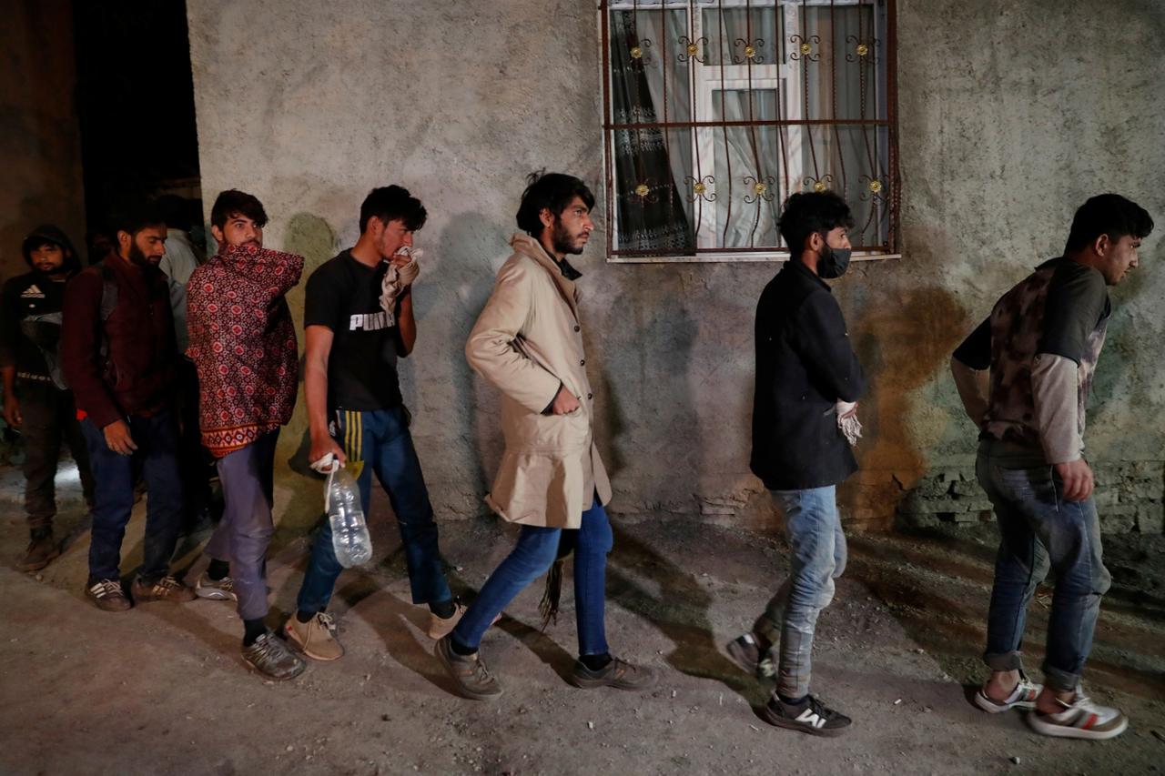 Migrants, mainly from Afghanistan, are seen after they were detained by Turkish security forces during an operation in the border city of Van