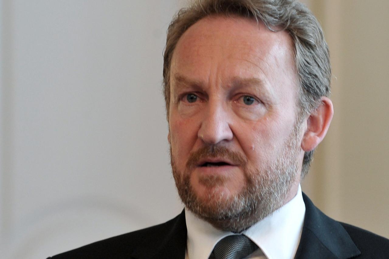 'Bakir Izetbegovic, Bosnian Muslim member of the tripartite Presidency of Bosnia and Herzegovina, delivers a short statement after meeting EU diplomacy chief Catherine Ashton in Sarajevo on May 13, 20