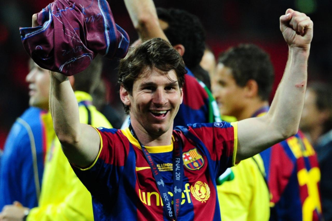 'Barcelona\'s Argentinian forward Lionel Messi celebrates at the end of the UEFA Champions League final football match FC Barcelona vs. Manchester United, on May 28, 2011 at Wembley stadium in London.