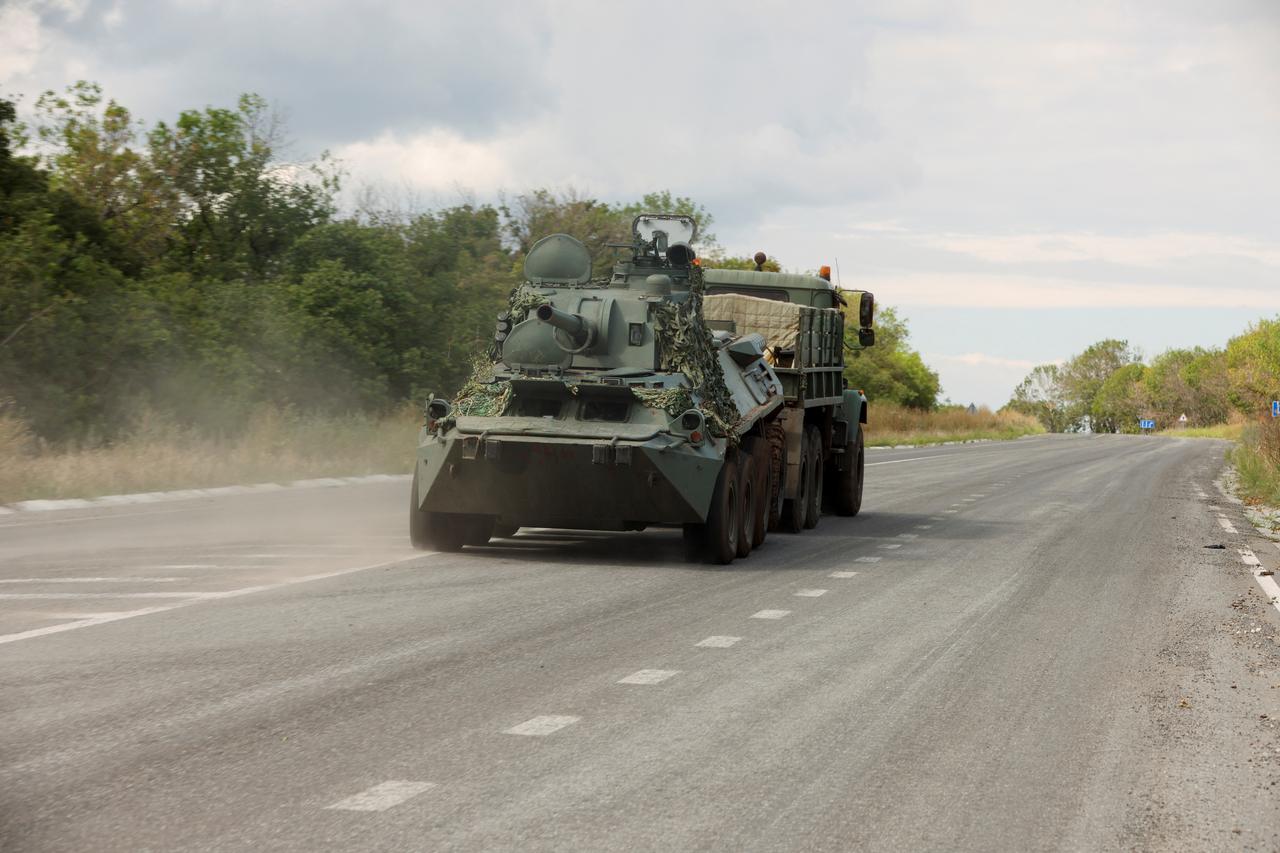 Ukrainian militaries with BTR drive out of Bakhmut