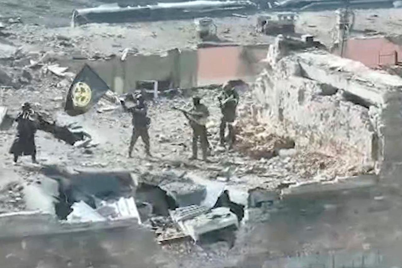 A still image taken from video apparently shows Wagner fighters on top of a building in Bakhmut