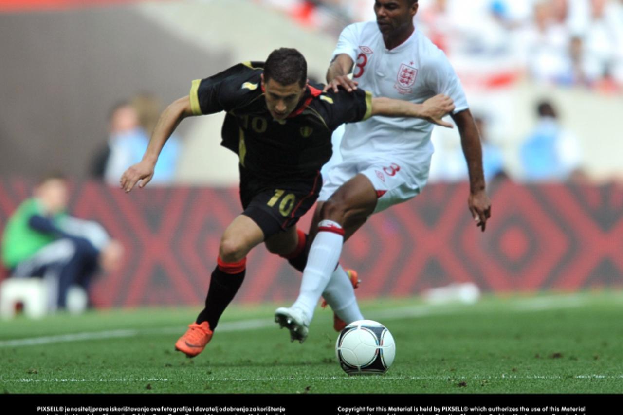 'Belgium\'s Eden Hazard (left) and England\'s Ashley Cole battle for the ballPhoto: Press Association/PIXSELL'