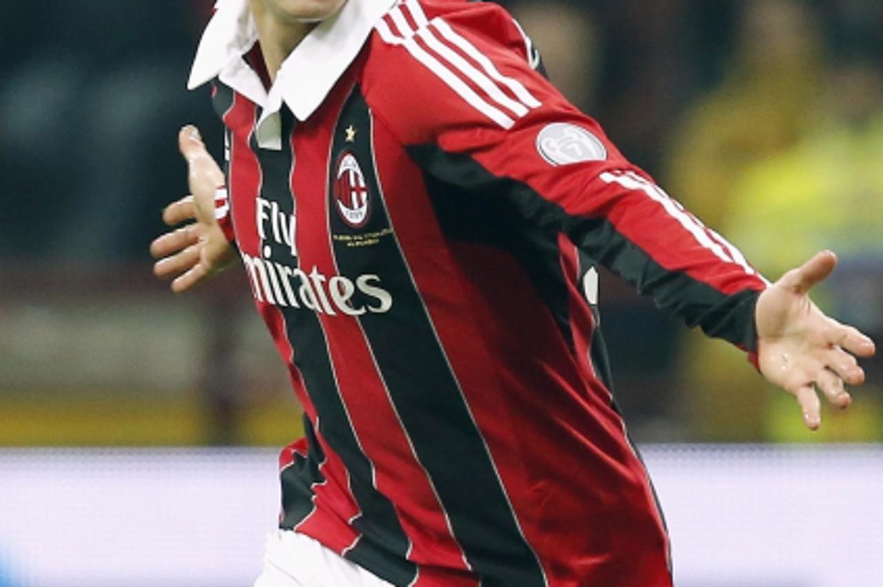 'AC Milan\'s Stephan El Shaarawy celebrates after scoring against Inter Milan during their Italian Serie A soccer match at the San Siro Stadium in Milan February 24, 2013. REUTERS/Stefano Rellandini (